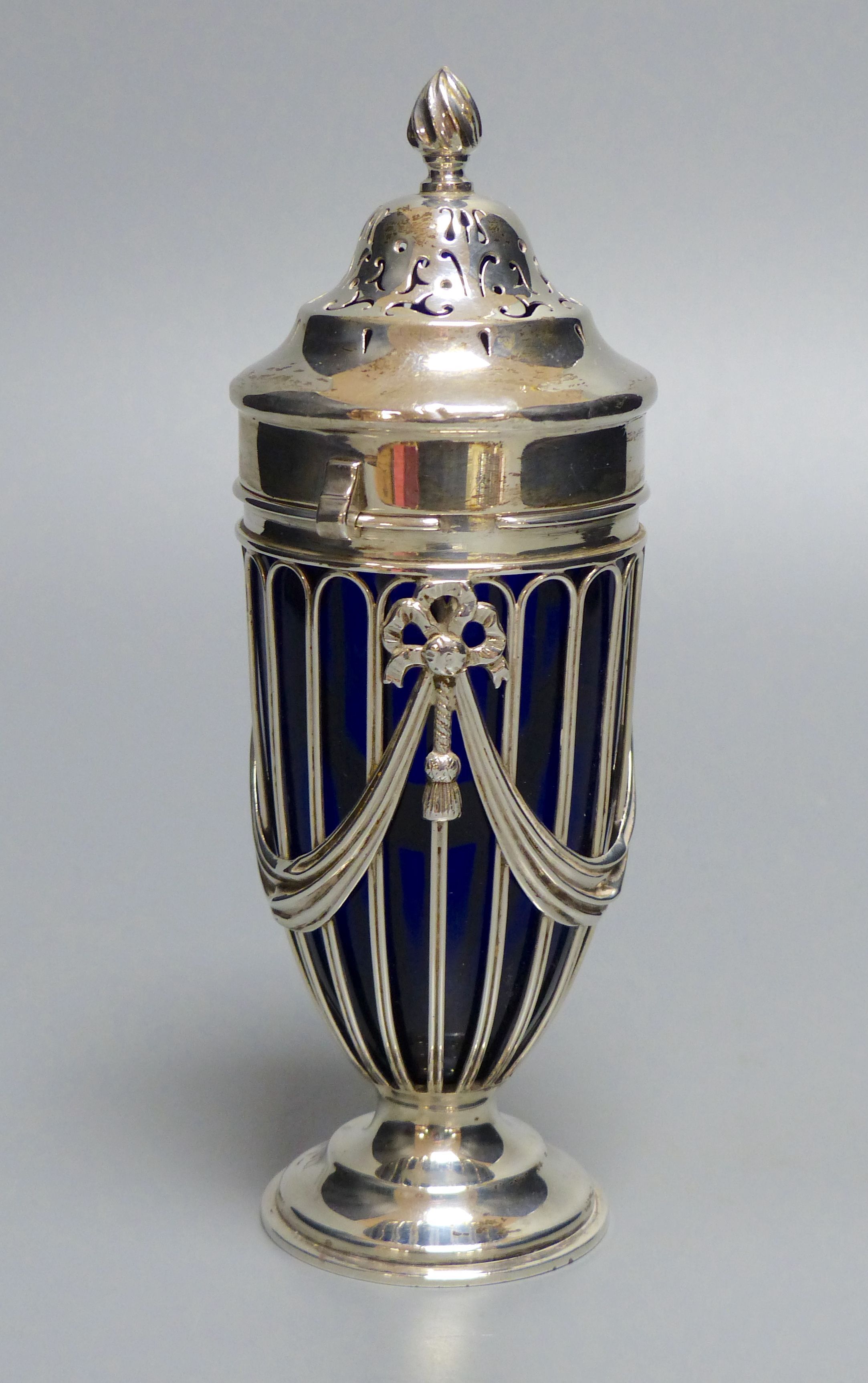 An Edwardian silver pedestal sugar sifter of Neo-Classical design,